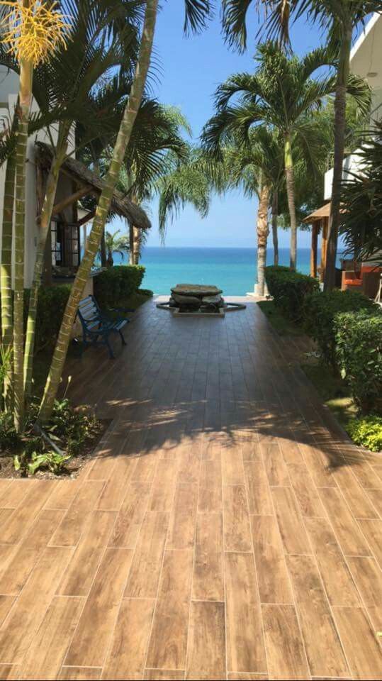 Dunno where this is, but I wanna walk barefoot on this deck leading to the beach somewhere tropical, travel photography, vacation, palm trees, #wanderings #cosmicinsider