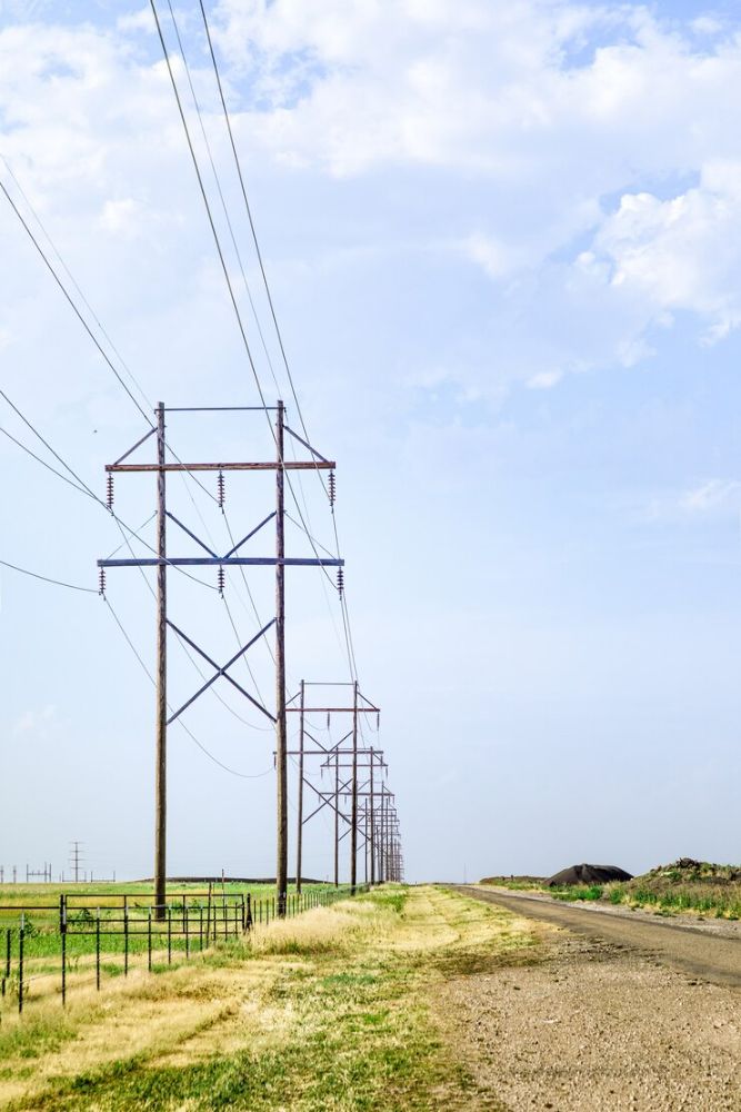 wooden-electic-poles-with-blue-sky_333098-22