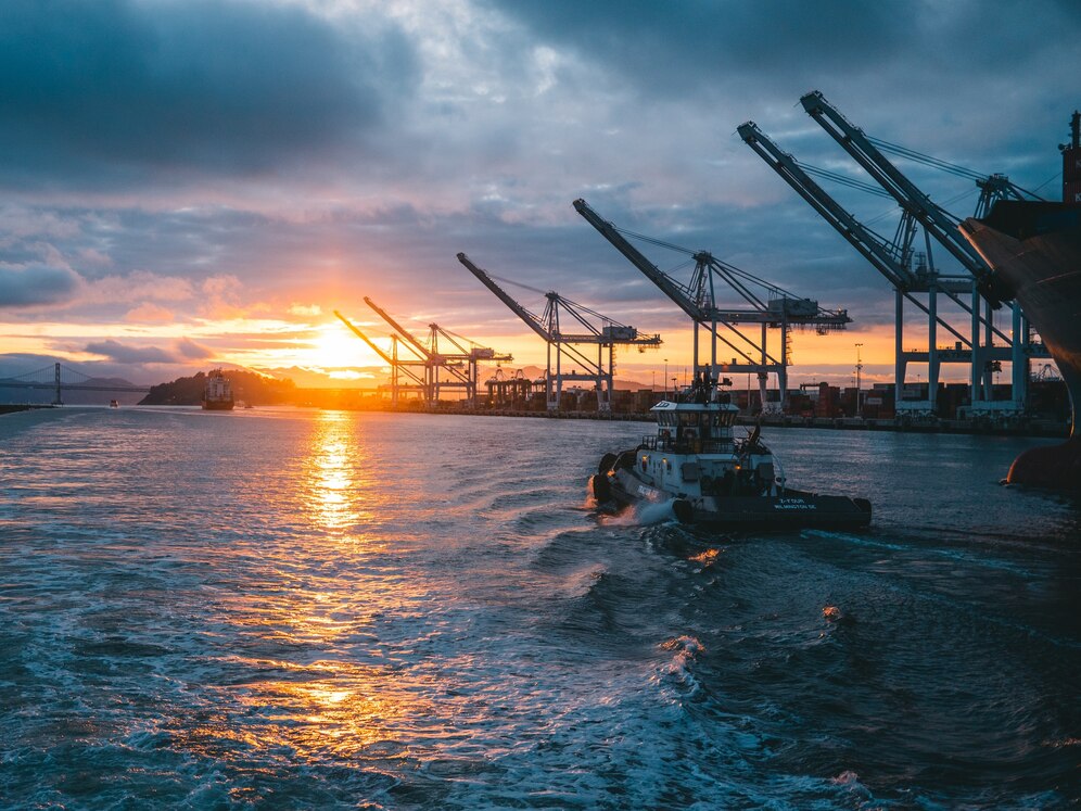 panoramic-shot-oil-rigs-sea-with-beautiful-sunset_181624-20797