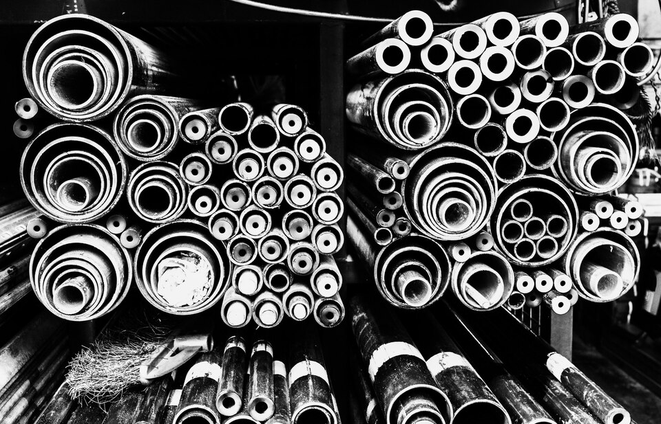 [freepicdownloader.com]-grayscale-steel-pipes-background-large