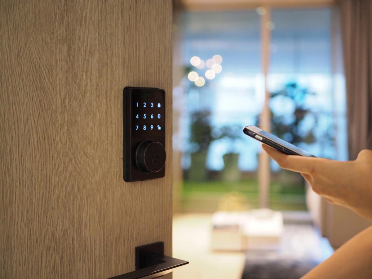 cropped-hands-unlocking-door-with-mobile-phone-home_1048944-7043430-1